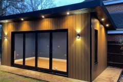 Garden office - 4 panel bifold door and fixed window on the side